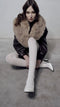 Cream ribbed wool tights styled with a fur-collared coat and white heels, Gibli Ribbed Wool Tights.