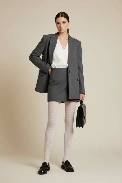 white patterned tights worn by a person on a white background