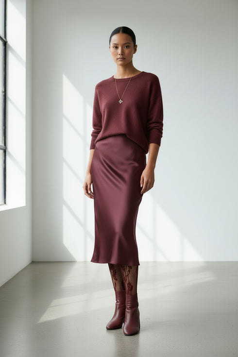 wine colored lace fishnet stockings on a white background