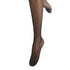 Black tights on a mannequin leg against a white background