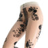 Sheer white tights with black floral lace pattern on a white background