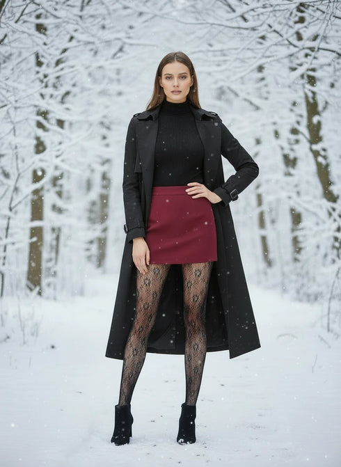 Black lace fleece-lined tights being worn in winter white background .