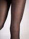 Black tights with a thin silver seam line on a white background