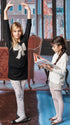 Two young girls in a staged indoor setting with a decorative background wearing cute tights.
