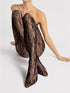 Black lace stockings worn by a model on a light gray background