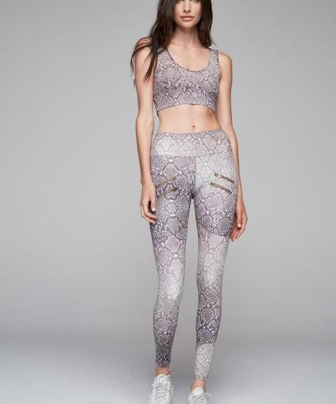 Palm leggings with a snake print pattern in gray and white, styled with a matching cropped top.