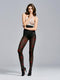 Flora Sheer Tights, tights with a black base featuring a floral pattern in red roses, worn with a sheer top and high heels.