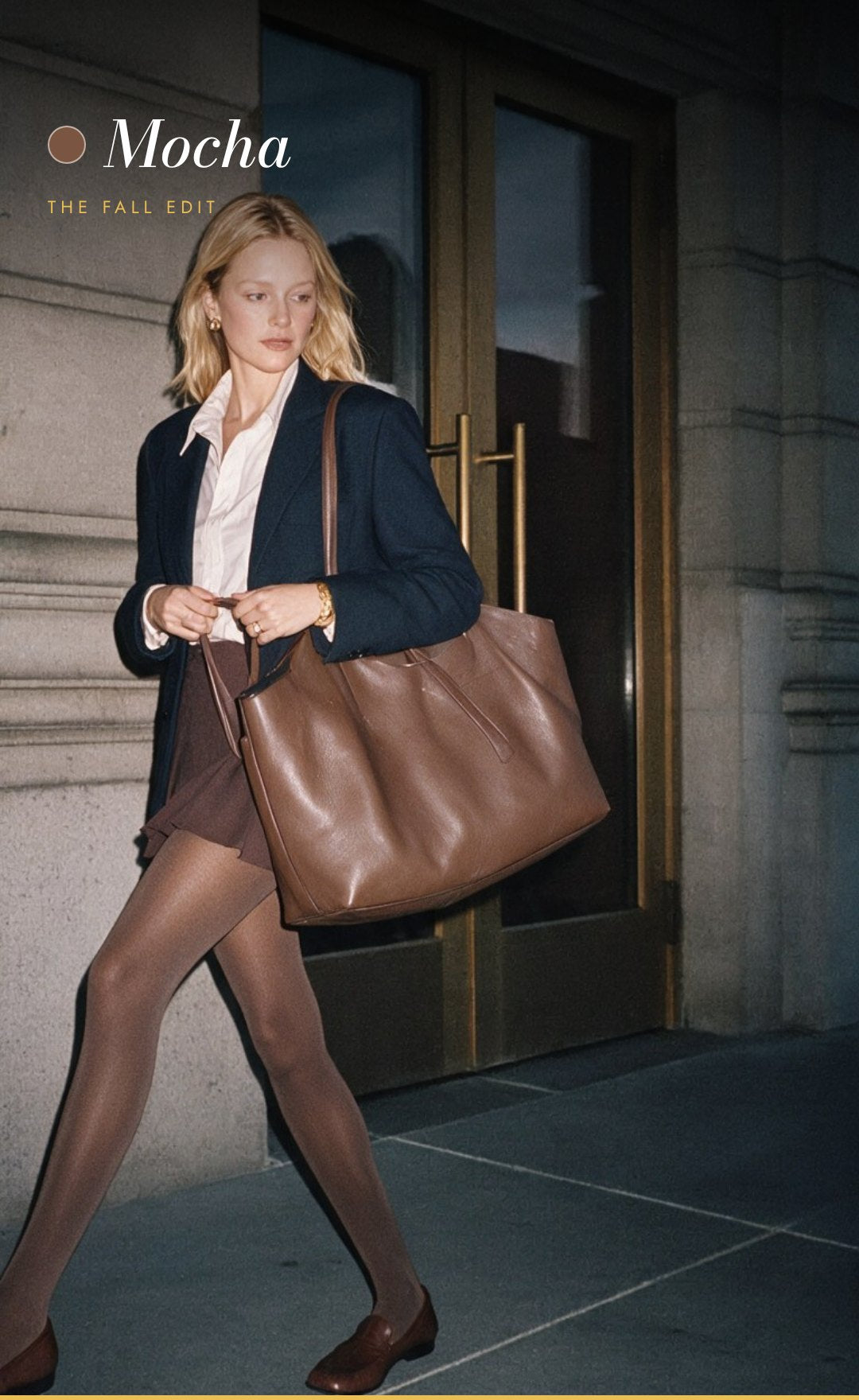 Woman in mocha tights carrying a large leather tote