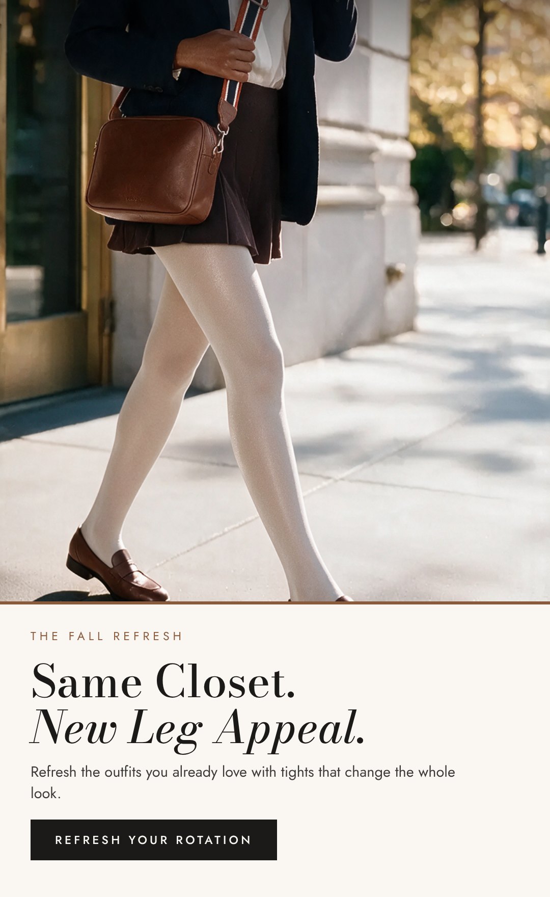 Woman in a navy blazer and brown mini skirt with ivory opaque tights